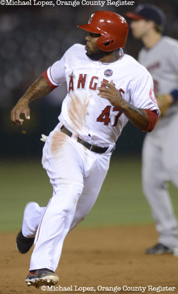 Angels Howard Kendrick advances to third base against the Twins Monday at Angel Stadium. – 7/22/13 – MICHAEL LOPEZ, ORANGE COUNTY REGISTER –   