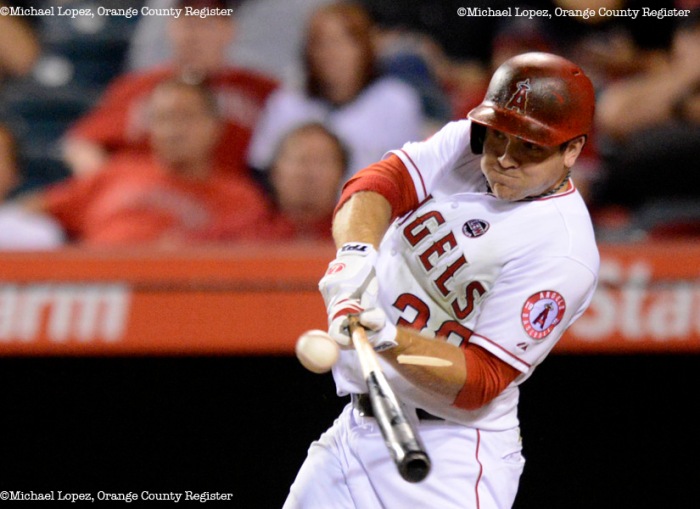 Angels J.B. Shuck connects with the ball splinting his bat in his game against the Twins Monday at Angel Stadium. – 7/22/13 – MICHAEL LOPEZ, ORANGE COUNTY REGISTER –  