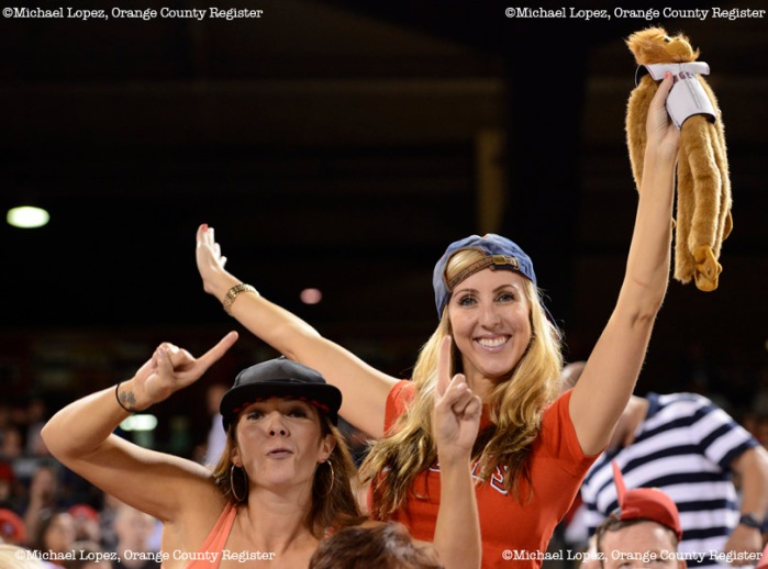 Shelly McGuire and Liana Romero cheer the Angels on in their game against the Twins Monday at Angel Stadium. – 7/22/13 – MICHAEL LOPEZ, ORANGE COUNTY REGISTER – 