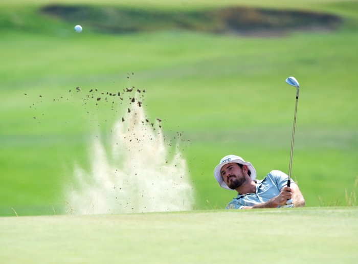 Drew Reinland works his way out of the sand trap at hole No. 2 during the Nortwest Open Golf Tournament Monday morning at the Wine Valley Golf Club in Walla Walla, Wa. 18 August 2015   (MICHAEL LOPEZ/Walla Walla Union-Bulletin via AP)